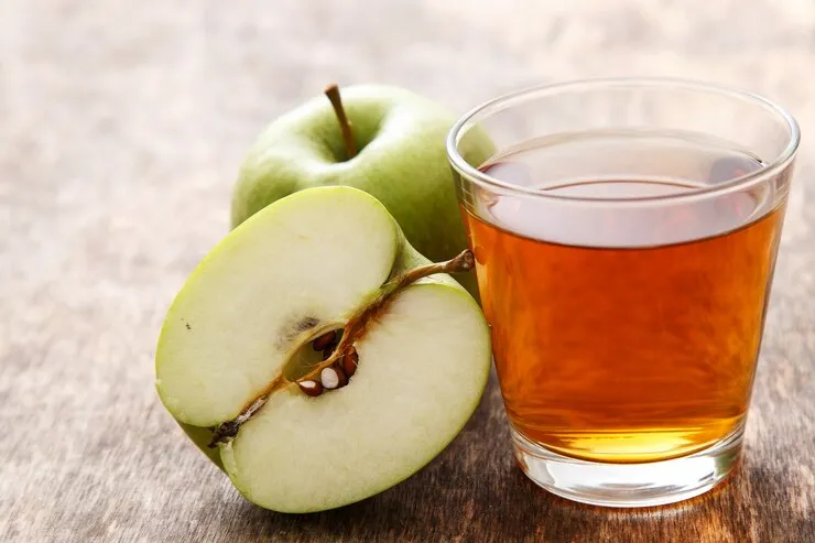apple cider vinegar in a glass.