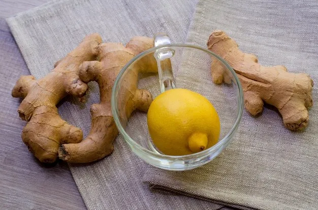 ginger with centrally placed lemon in a cup for acid reflux.