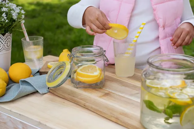 a person preparing caffeine-free lemonade.