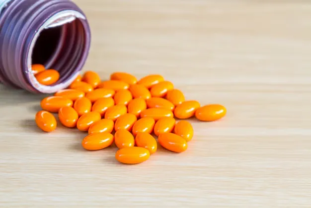 dayquil capsules coming out of bottle.