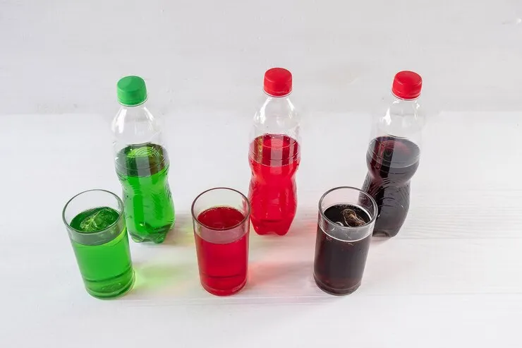 bottles of different sports drinks with white backgrounds.