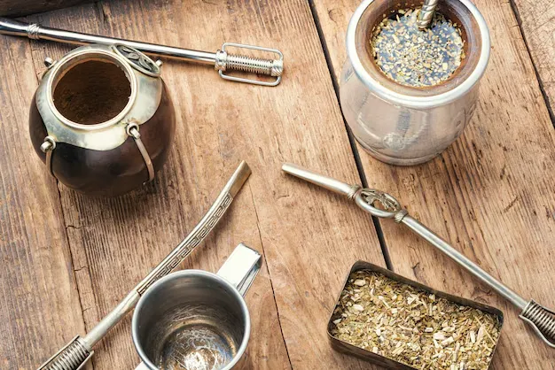 yerba mate placed on a wooden surface.