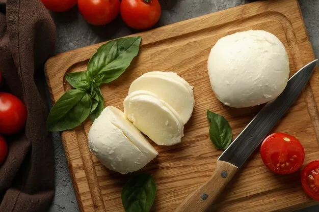 mozzarella cheese slices on a cutting board