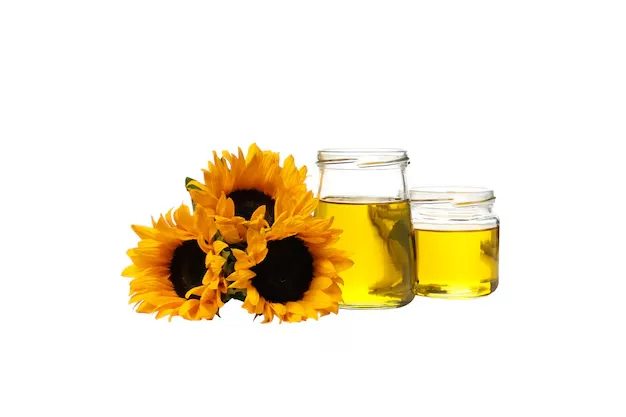 sunflower oil in glass jars with sunflowers