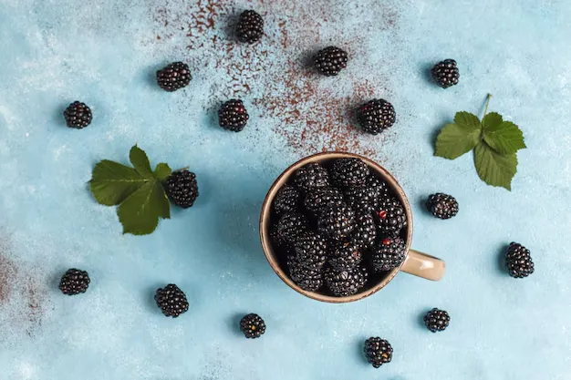 top view of blackberries in a cup