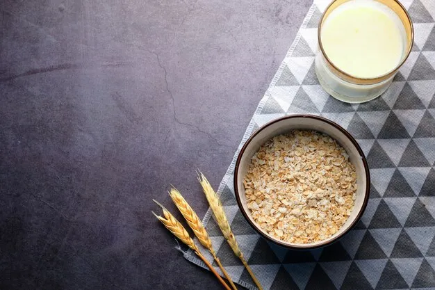 uncooked oats in a small bowl with a glass of milk.